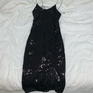Black sequins party dress. Size xs but fits a bit tighter in the upper chest.